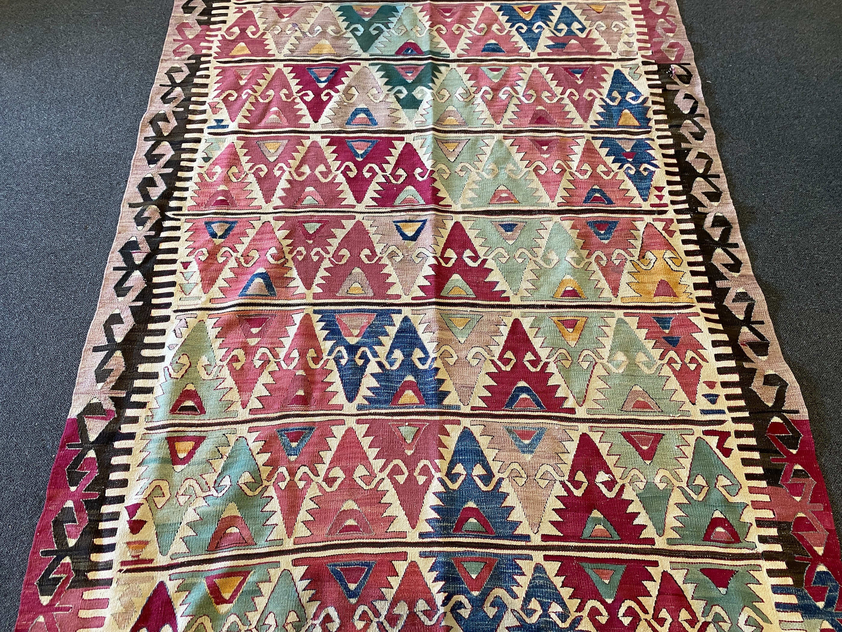 An Anatolian Kilim flatweave polychrome hall carpet, 410 x 156cm